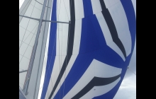 After our disasterous Spinnaker experience, we re-hoisted it briefly to work out all the kinks. Can you see the new tears?
